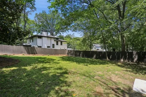 a view of a backyard with a small cabin