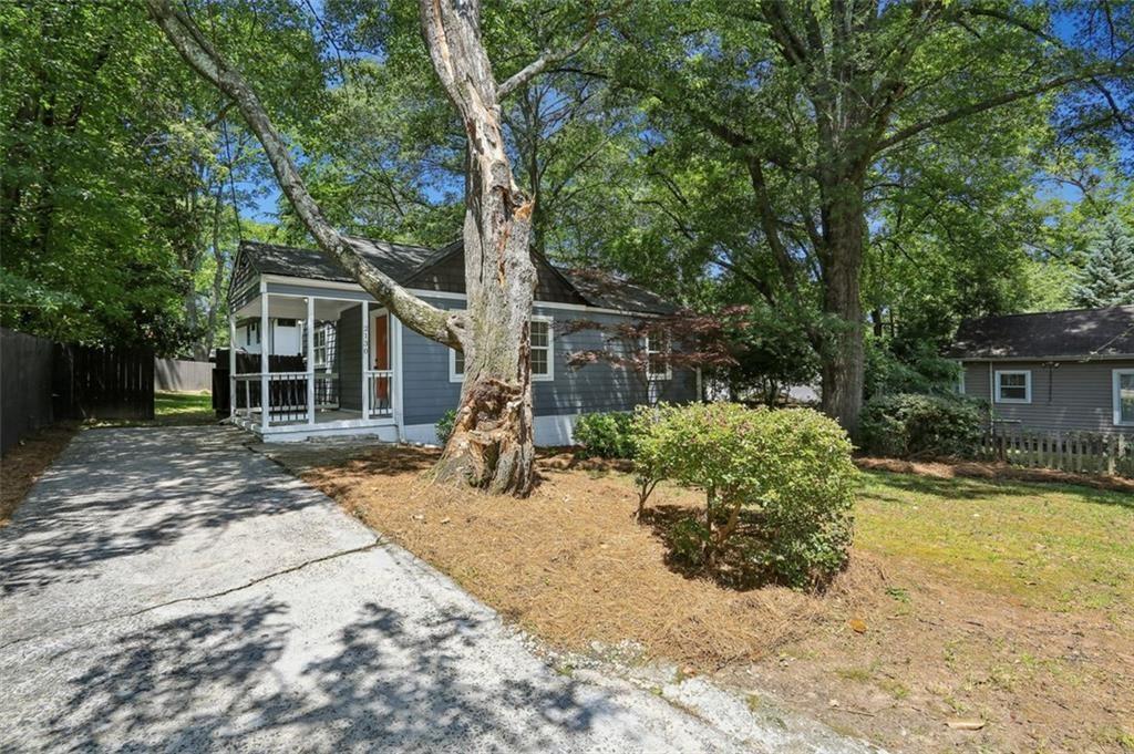 2130 Main Street Northwest Atlanta, GA 30318 - Photo 2 of 17 a house with a tree in the background