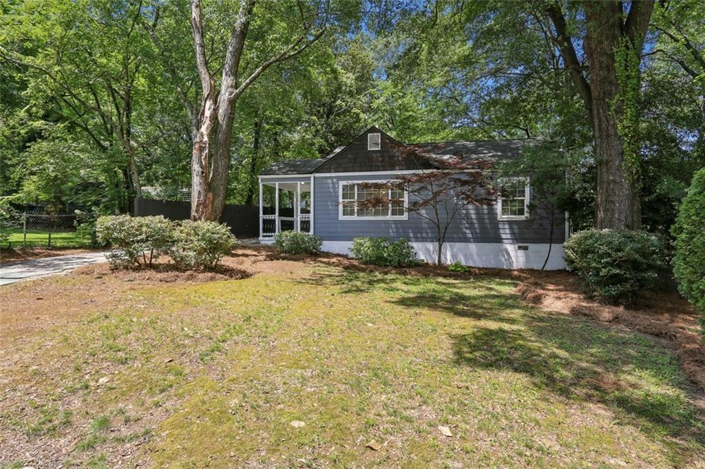 2130 Main Street Northwest Atlanta, GA 30318 - Photo 3 of 17 a backyard of a house with yard and outdoor seating
