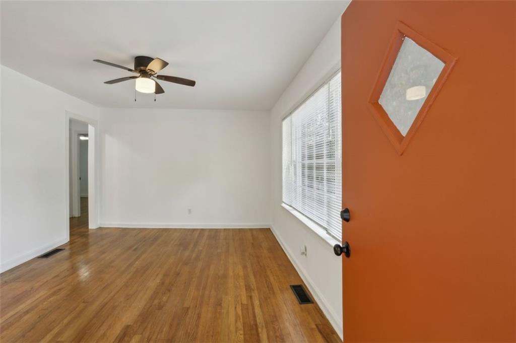 2130 Main Street Northwest Atlanta, GA 30318 - Photo 4 of 17 a view of empty room with wooden floor and fan