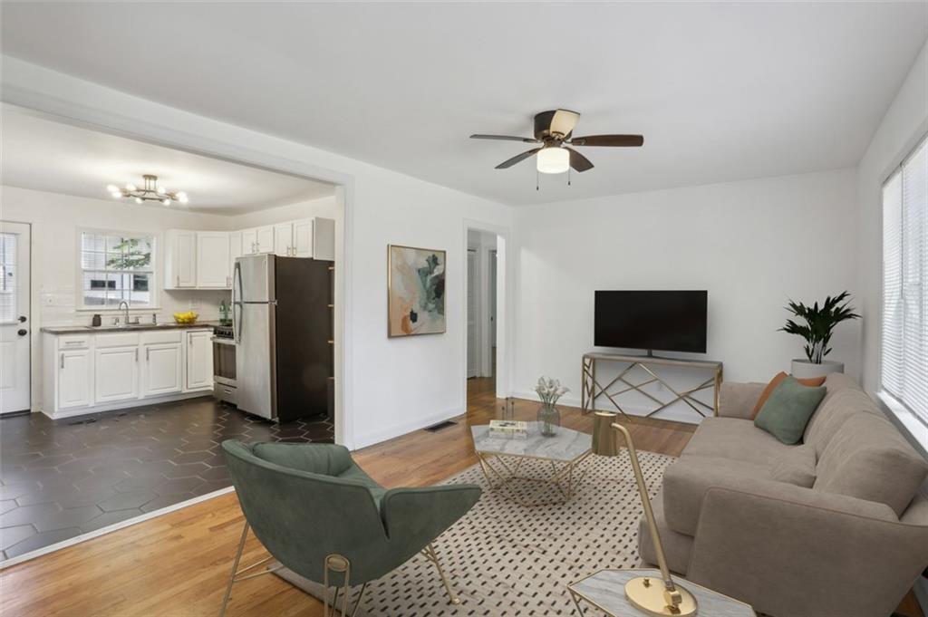 2130 Main Street Northwest Atlanta, GA 30318 - Photo 5 of 17 a living room with furniture and a flat screen tv