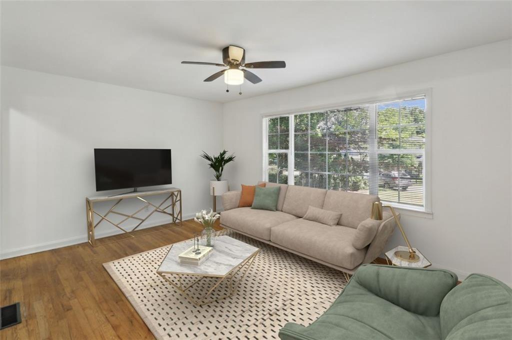 2130 Main Street Northwest Atlanta, GA 30318 - Photo 6 of 17 a living room with furniture and a flat screen tv