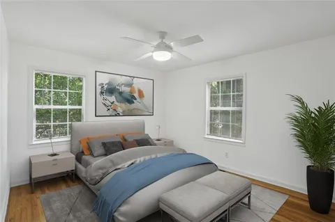 a bedroom with a large bed and a window