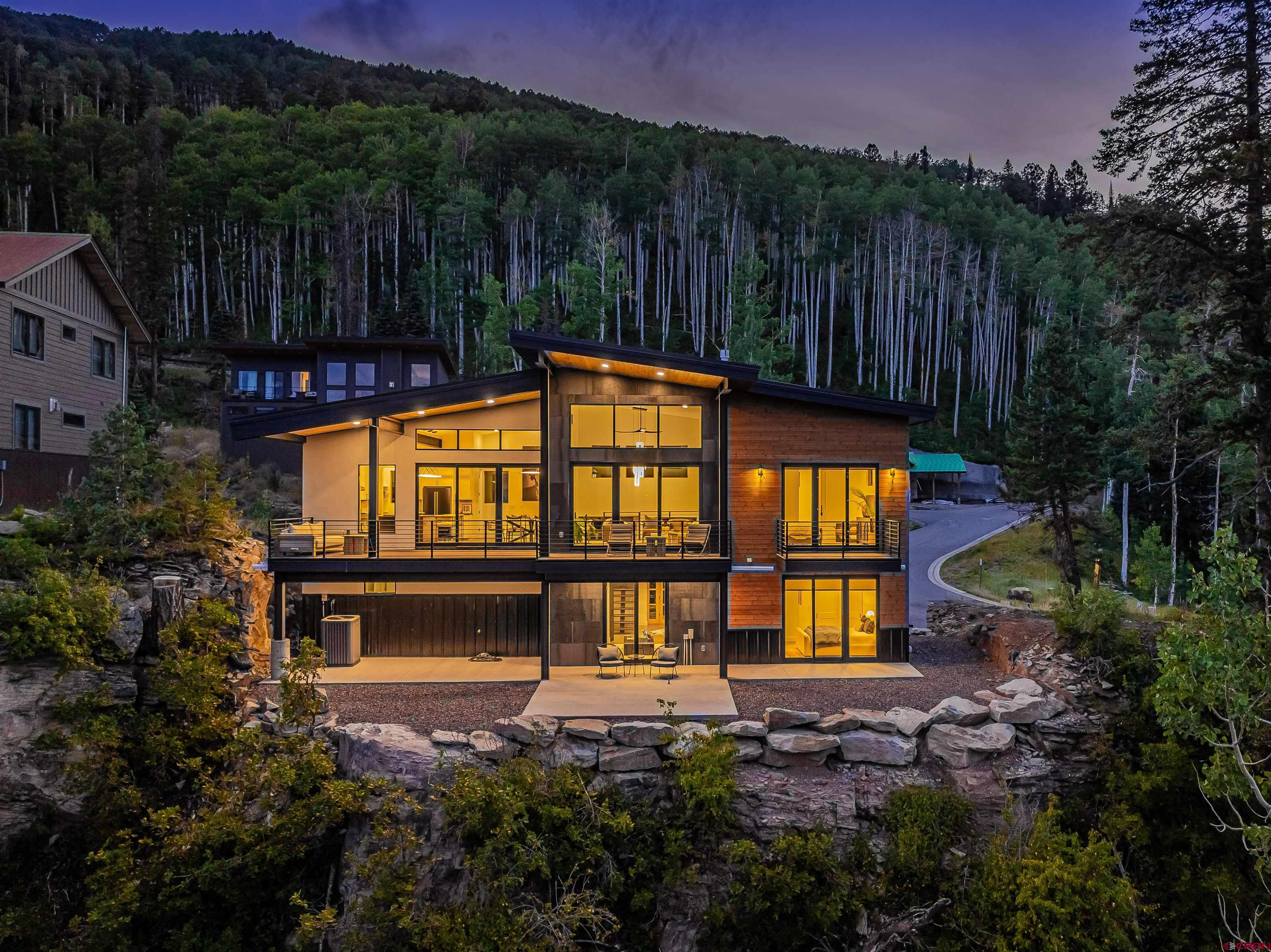 a view of a house with pool and garden