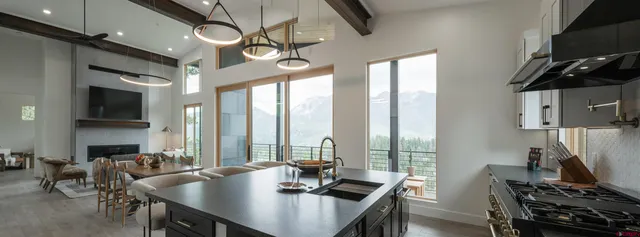 a view of a dining room with furniture window and outside view