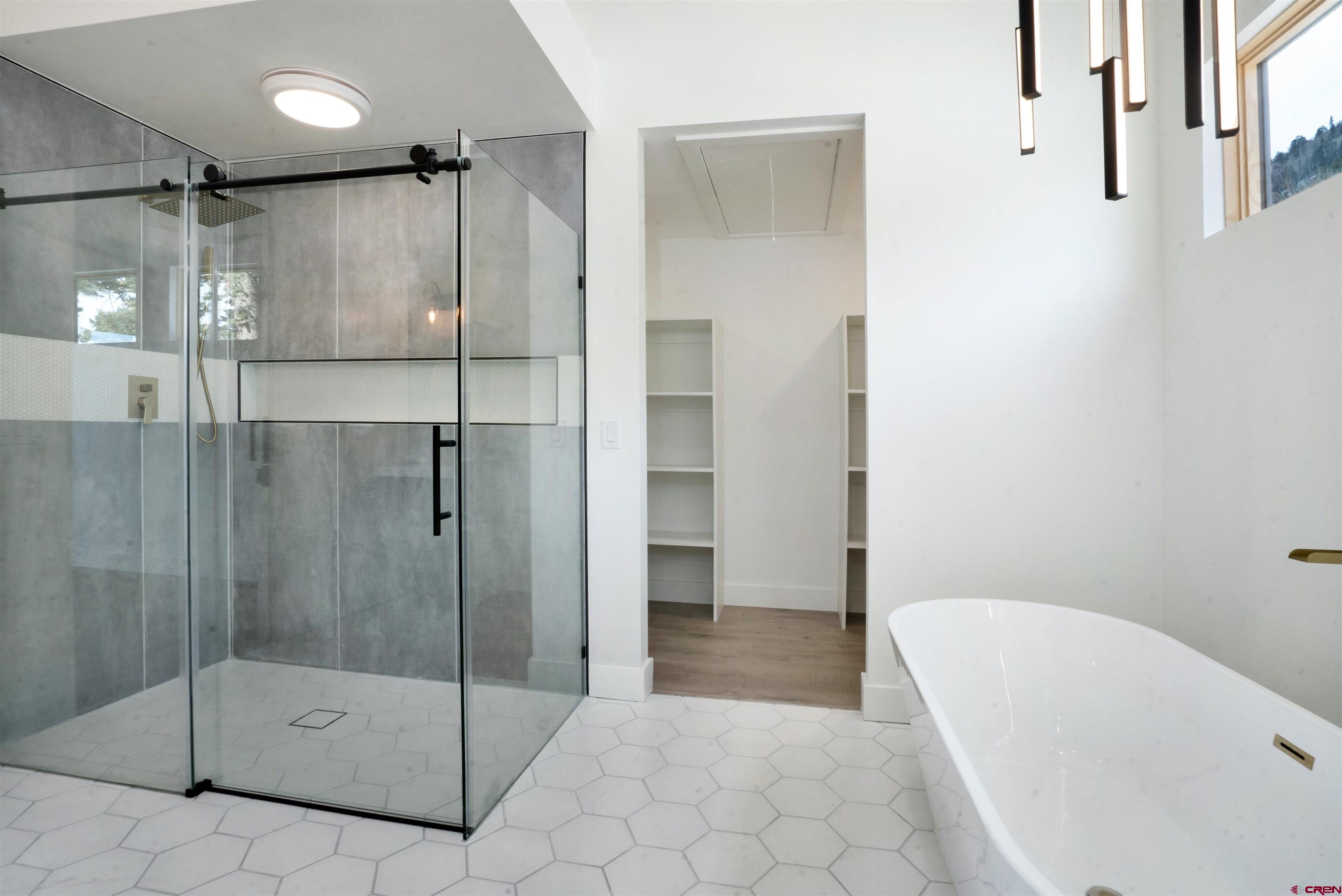 9 Cherub Court Durango, CO 81301 - Photo 15 of 45 a bathroom with a shower and a bathtub