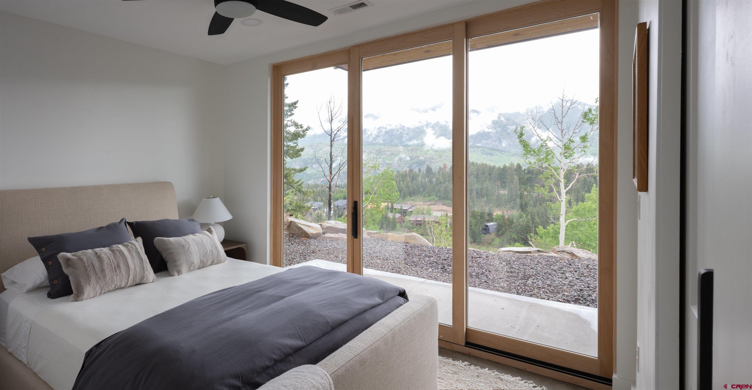 9 Cherub Court Durango, CO 81301 - Photo 19 of 45 a bedroom with a large bed and a balcony view