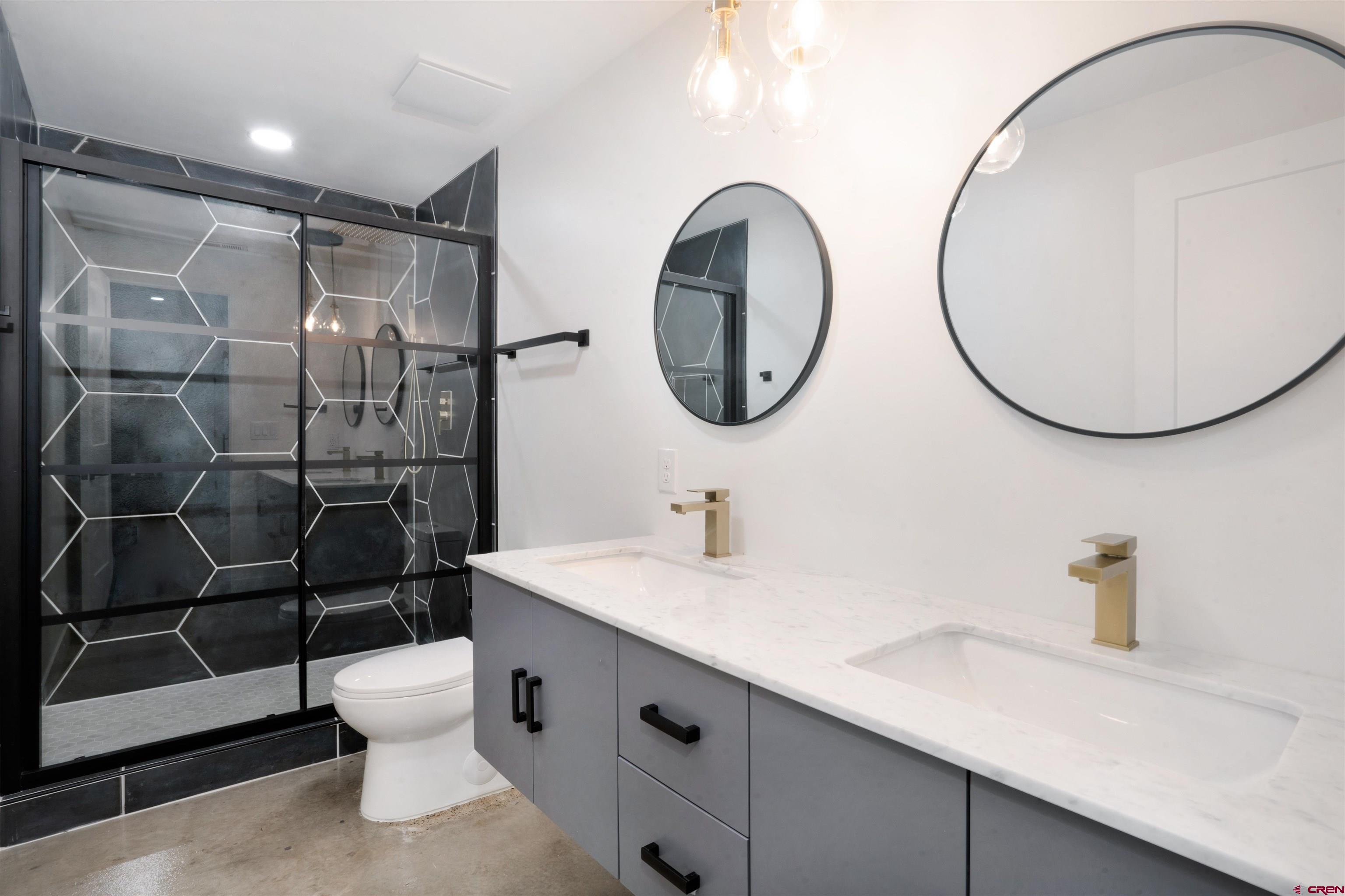 9 Cherub Court Durango, CO 81301 - Photo 20 of 45 a bathroom with a sink mirror vanity and toilet