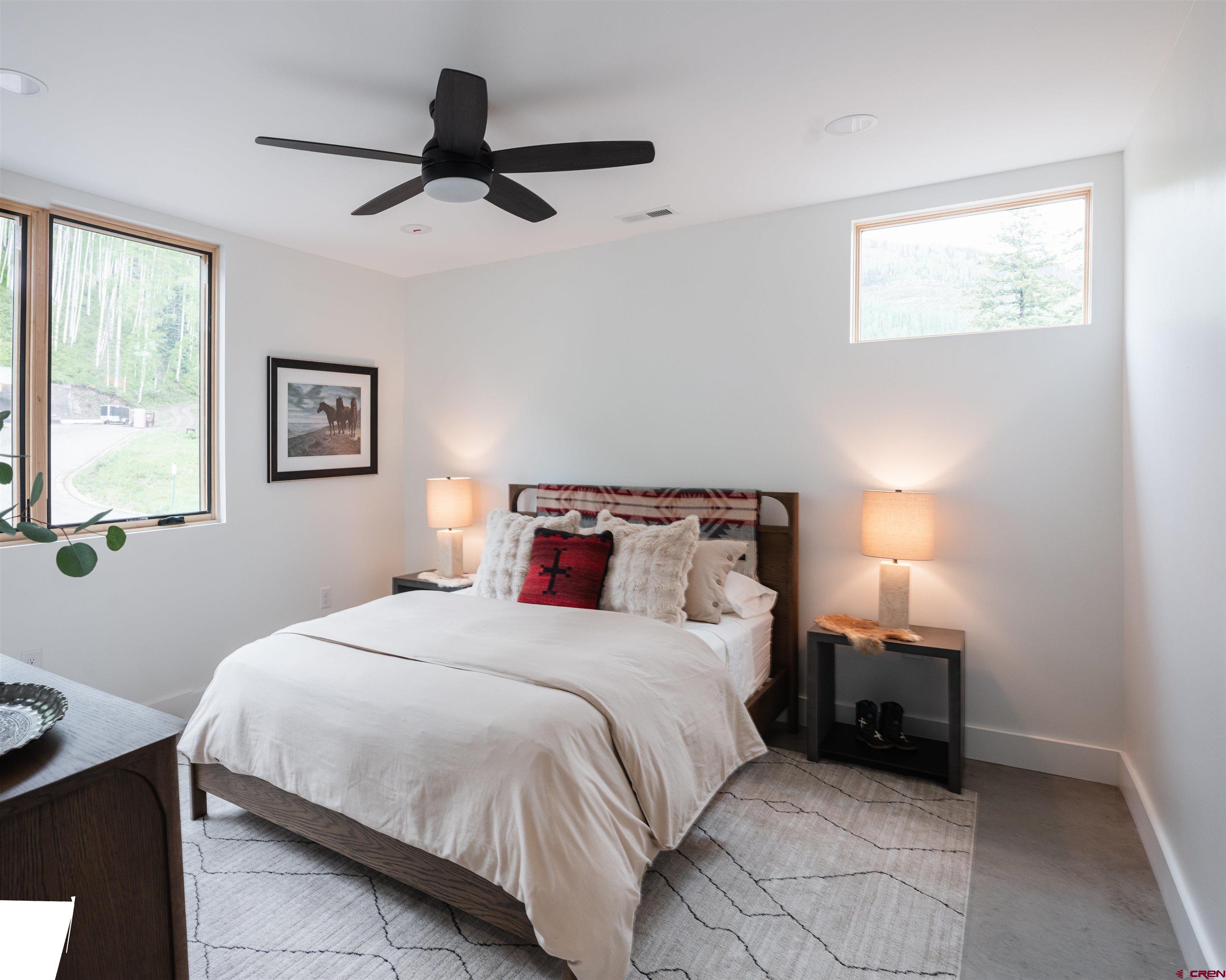 9 Cherub Court Durango, CO 81301 - Photo 21 of 45 a bedroom with a bed and a painting on the wall
