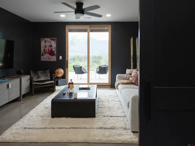 a living room with furniture and a large window