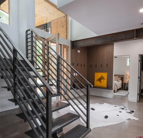 a view of staircase with a rug
