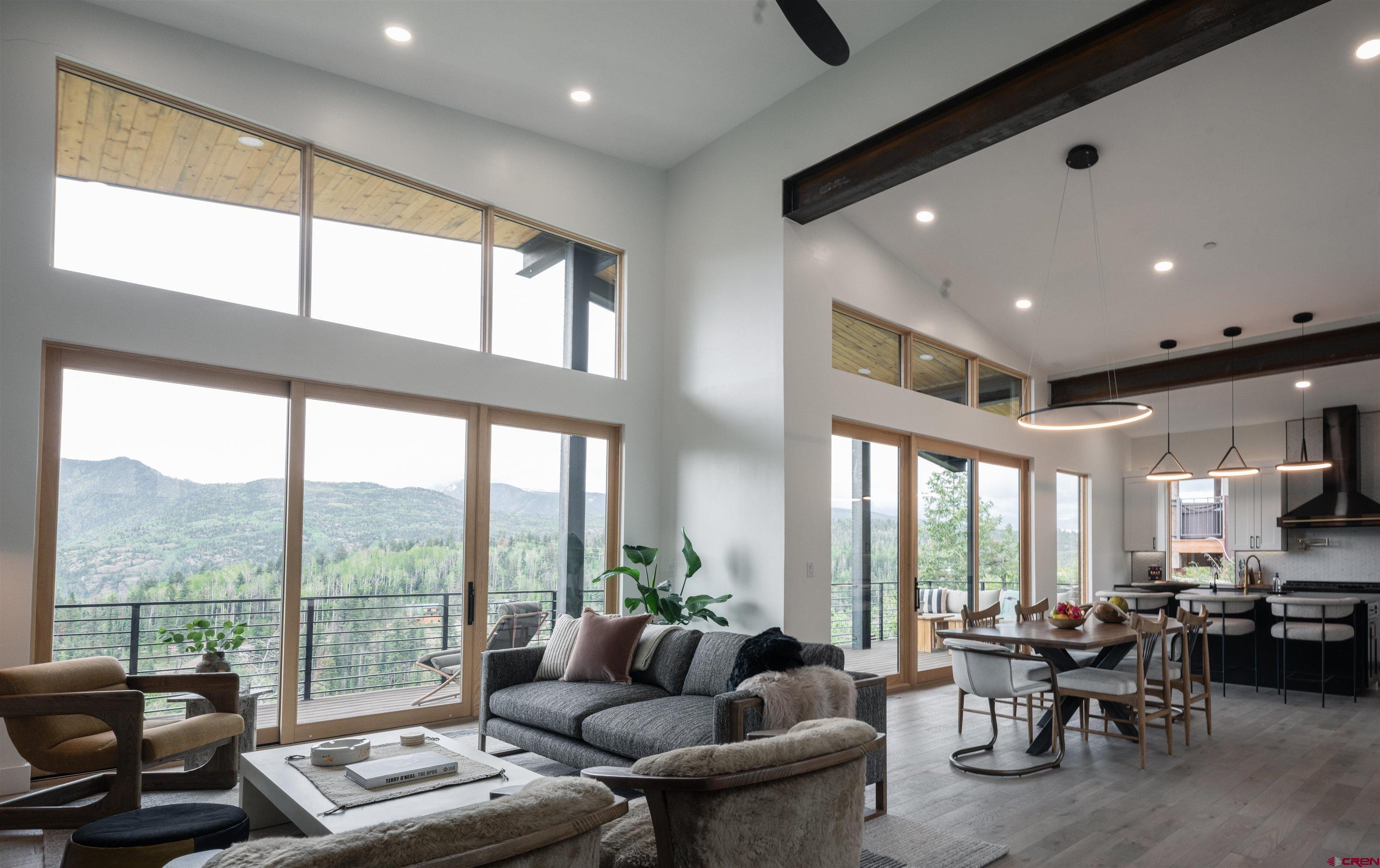 9 Cherub Court Durango, CO 81301 - Photo 3 of 45 a living room with furniture and floor to ceiling windows