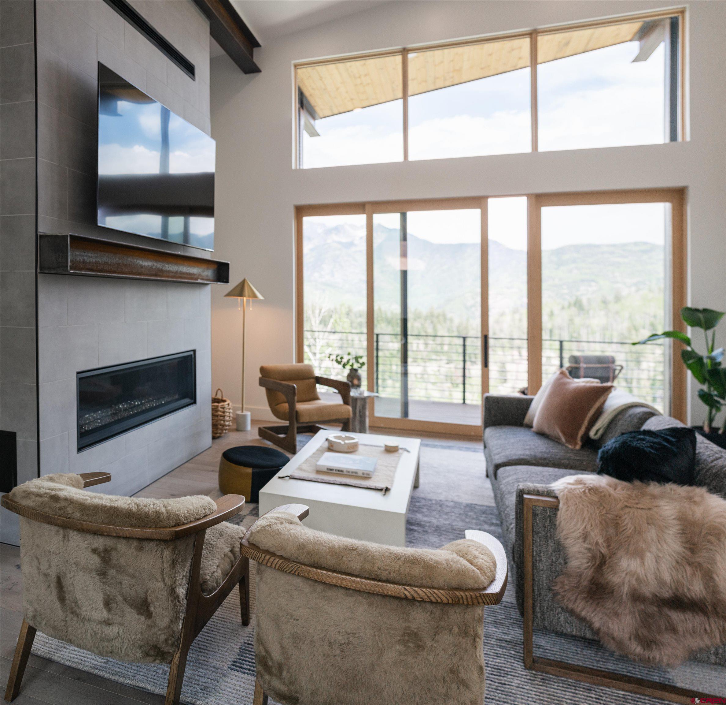 9 Cherub Court Durango, CO 81301 - Photo 7 of 45 a living room with furniture a flat screen tv and a fireplace
