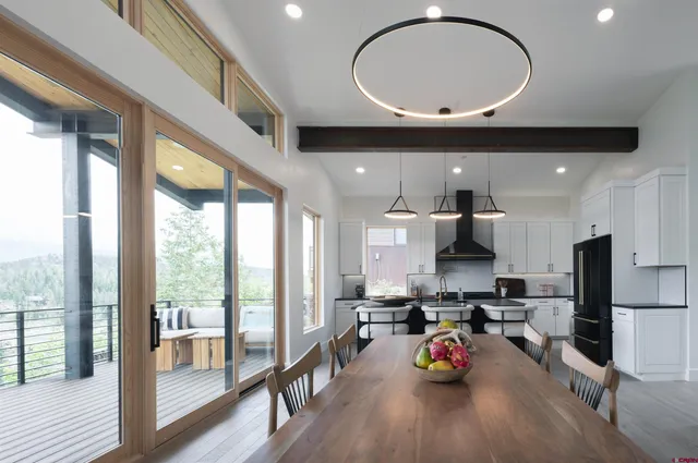 a open kitchen with stainless steel appliances granite countertop a stove and refrigerator