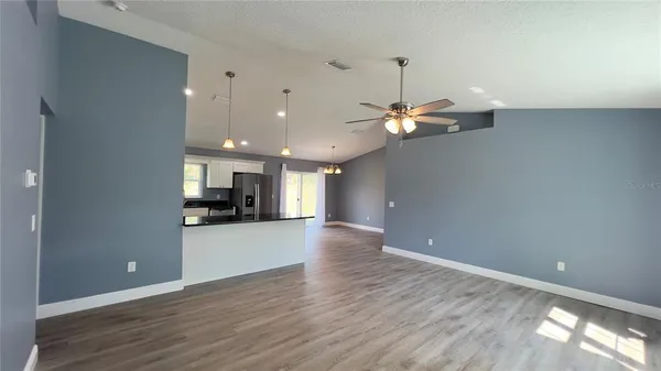 a view of a kitchen with a sink and a window