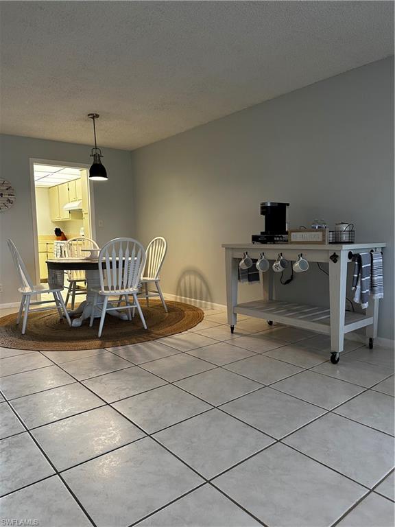 1000 Manatee Road, Unit A105 Naples, FL 34114 - Photo 4 of 22 a living room with furniture a dining table and a window