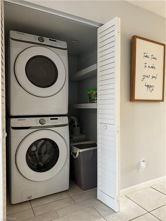 1000 Manatee Road, Unit A105 Naples, FL 34114 - Photo 7 of 22 a utility room with dryer and washer