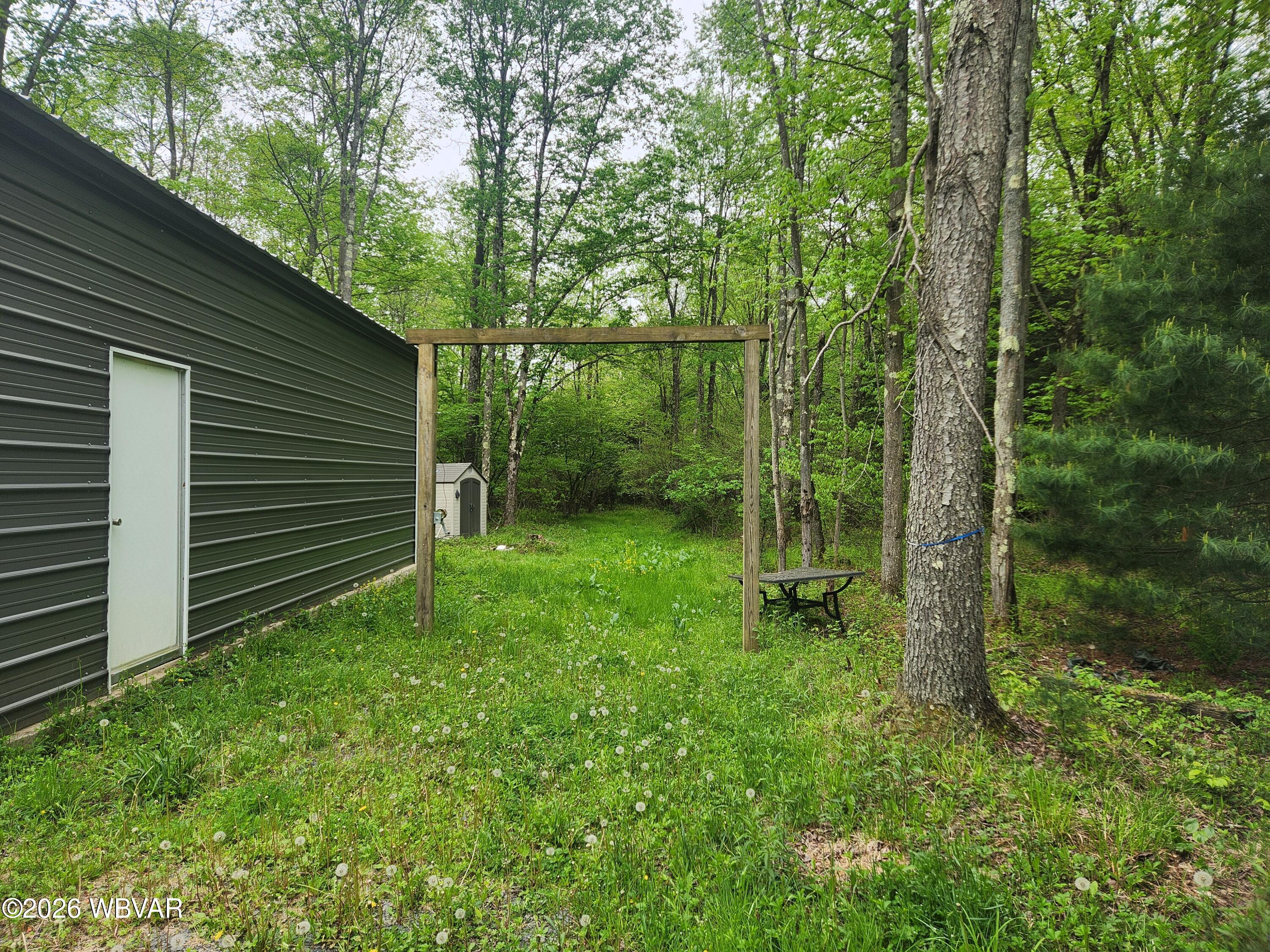 980 State Rte 4007 Forksville, PA 18616 - Photo 23 of 31 Man door to newer build pole barn with concrete floor