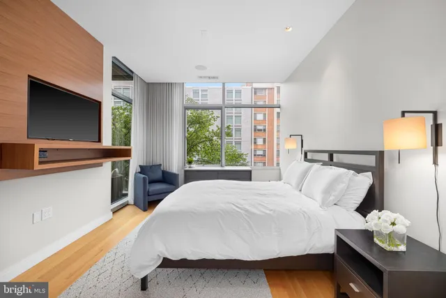 a bedroom with a bed and window