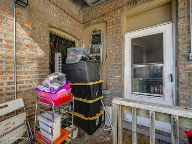 a front view of a house with outdoor seating