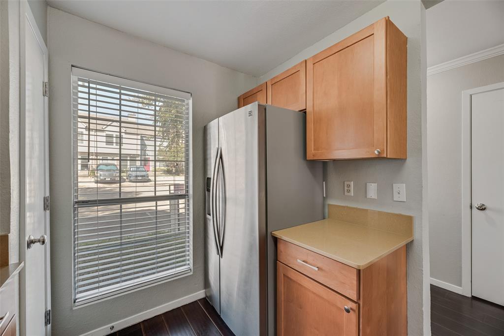 43 Abbey Road Euless, TX 76039 - Photo 12 of 22 a kitchen with a refrigerator and a sink