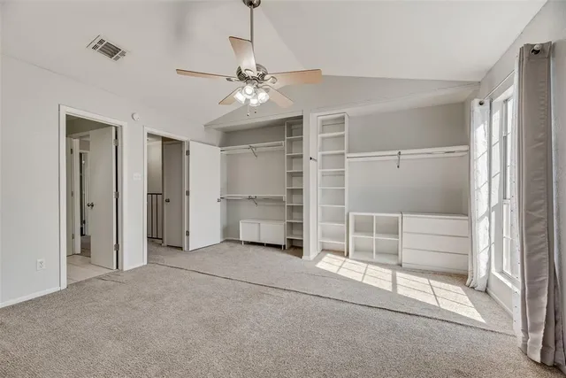 a view of an empty room with a fireplace