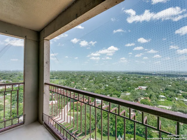 a view of a city skyline from a balcony