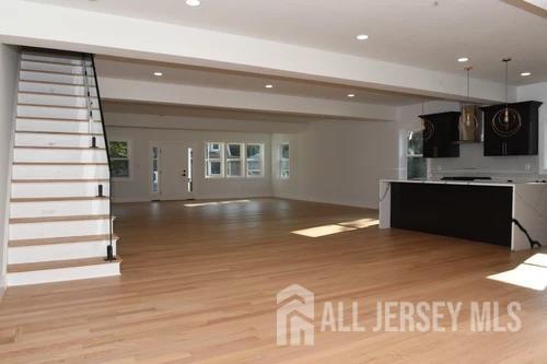 28 Plymouth Place Edison, NJ 08837 - Photo 11 of 33 a view of kitchen and hall with wooden floor