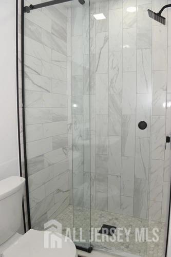 28 Plymouth Place Edison, NJ 08837 - Photo 16 of 33 a bathroom with a shower and a toilet