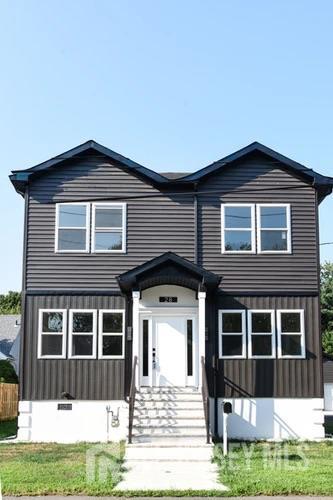 28 Plymouth Place Edison, NJ 08837 - Photo 2 of 33 a front view of a house with a yard