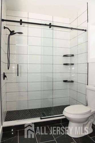 28 Plymouth Place Edison, NJ 08837 - Photo 25 of 33 a bathroom with a toilet and a shower