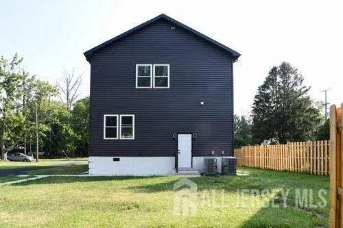 a backyard of a house with yard and garage