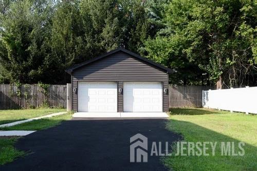 28 Plymouth Place Edison, NJ 08837 - Photo 33 of 33 a front view of a house with a yard
