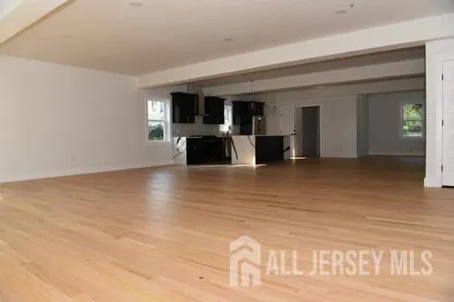 a view of livingroom with furniture and a flat screen tv