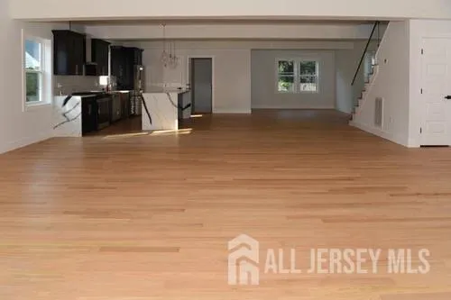 a view of empty room with window and fireplace