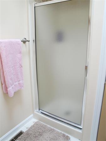 36 Byron Road Natick, MA 01760 - Photo 11 of 20 a bathroom with a glass door