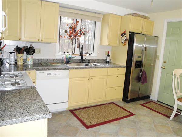36 Byron Road Natick, MA 01760 - Photo 6 of 20 a kitchen with granite countertop a sink stove and refrigerator
