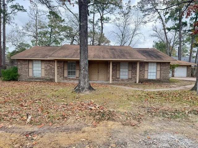 a house with trees in the background
