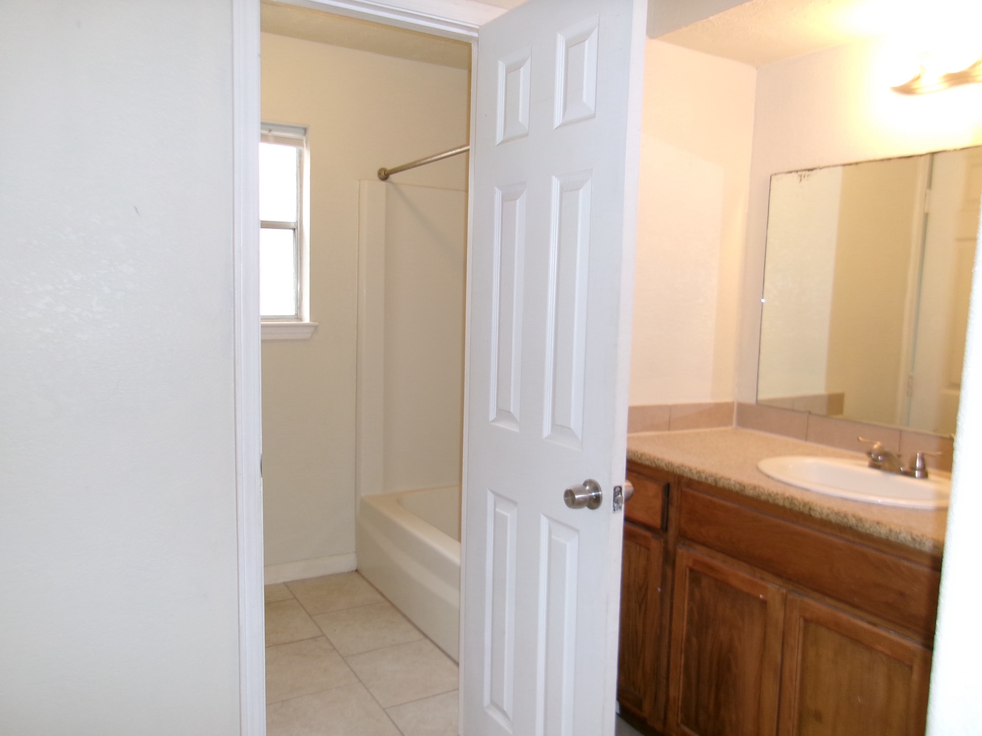 6214 Nowlin Drive Baytown, TX 77521 - Photo 9 of 12 a bathroom with a sink and a mirror
