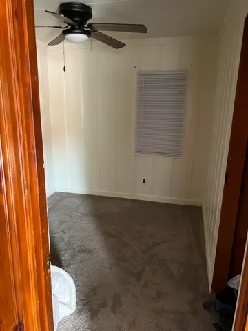 a view of a bathroom with a shower and a window