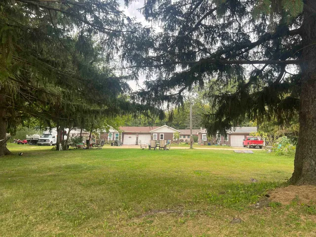 a view of a park with large trees