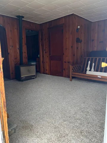 a view of an empty room with a fireplace