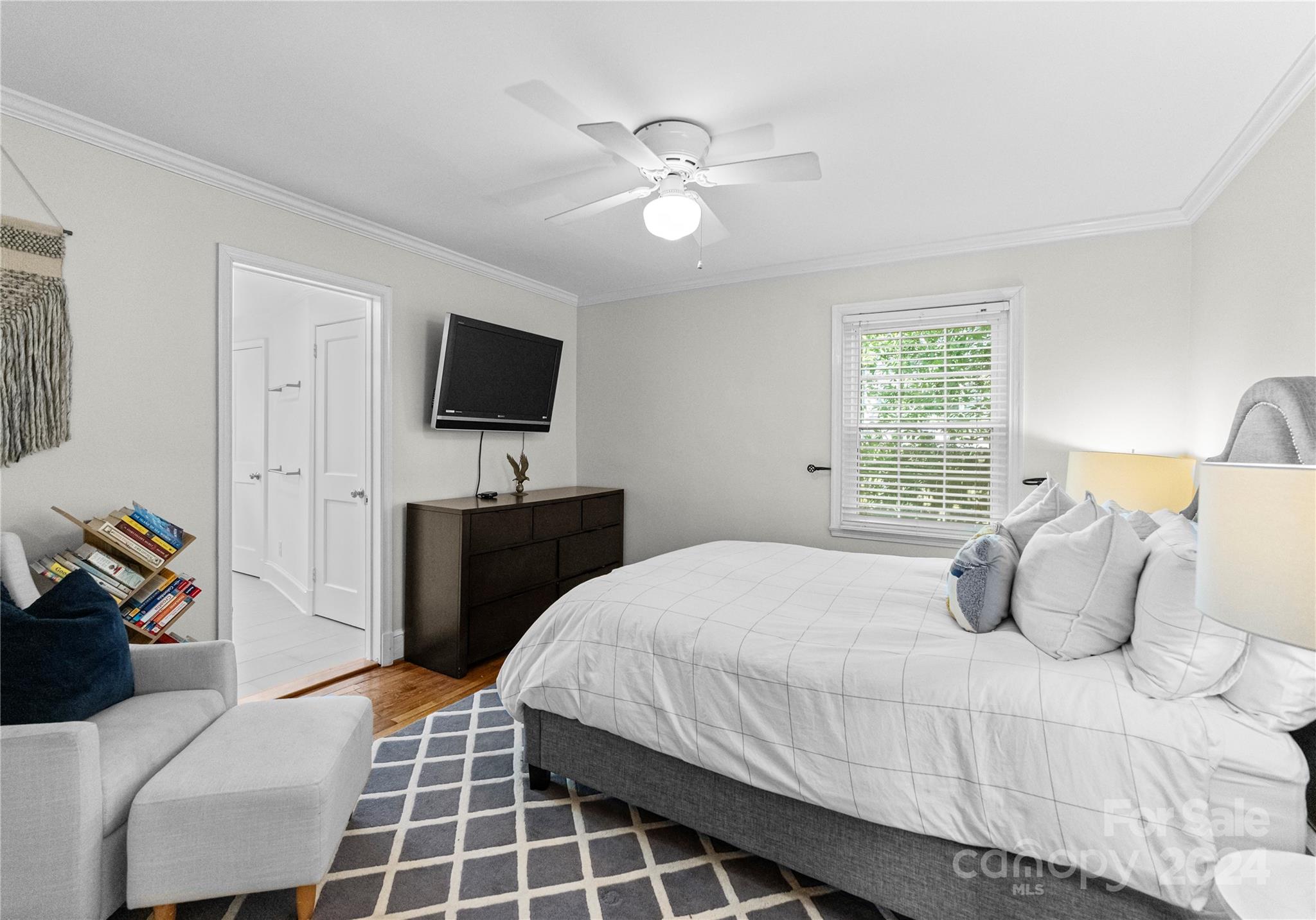1108 Sedgefield Road Charlotte, NC 28209 - Photo 12 of 24 a bedroom with a bed and a flat screen tv