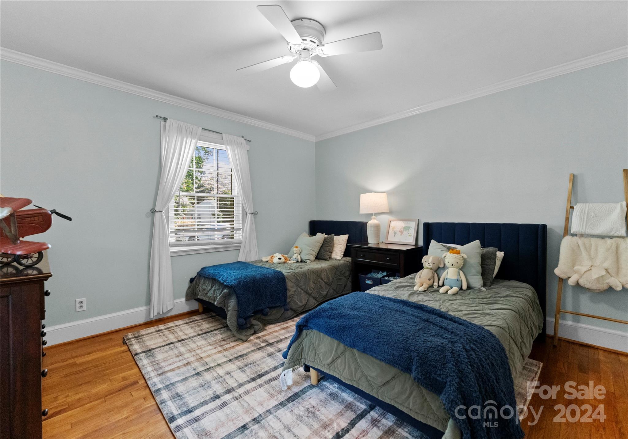1108 Sedgefield Road Charlotte, NC 28209 - Photo 15 of 24 a bedroom with two beds and a chandelier