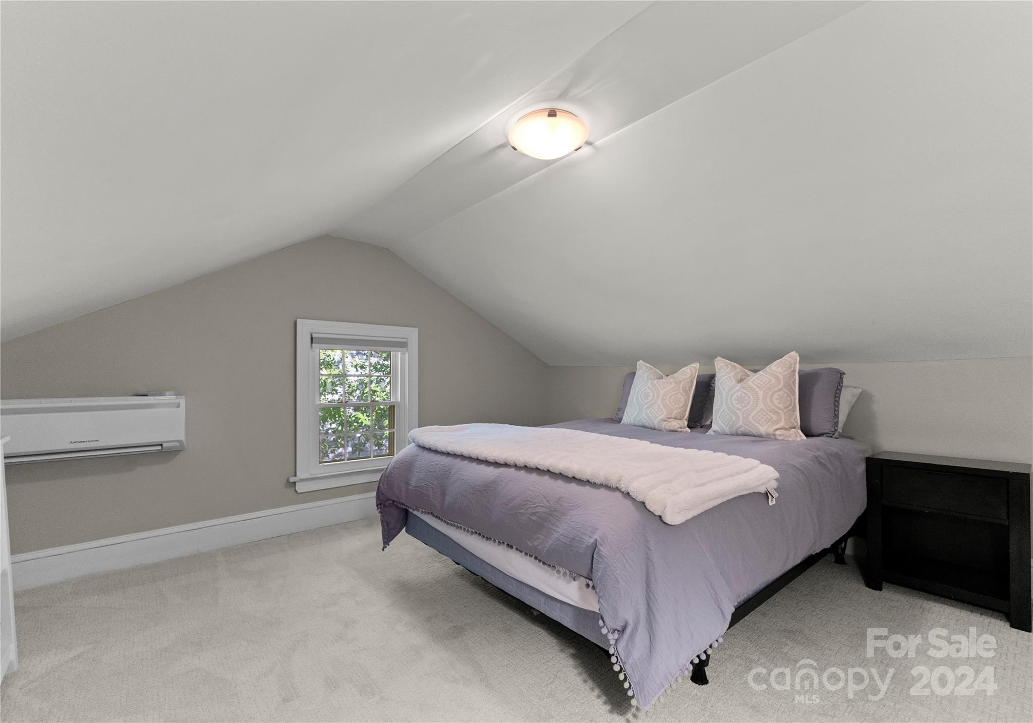 1108 Sedgefield Road Charlotte, NC 28209 - Photo 19 of 24 a bedroom with a bed and window