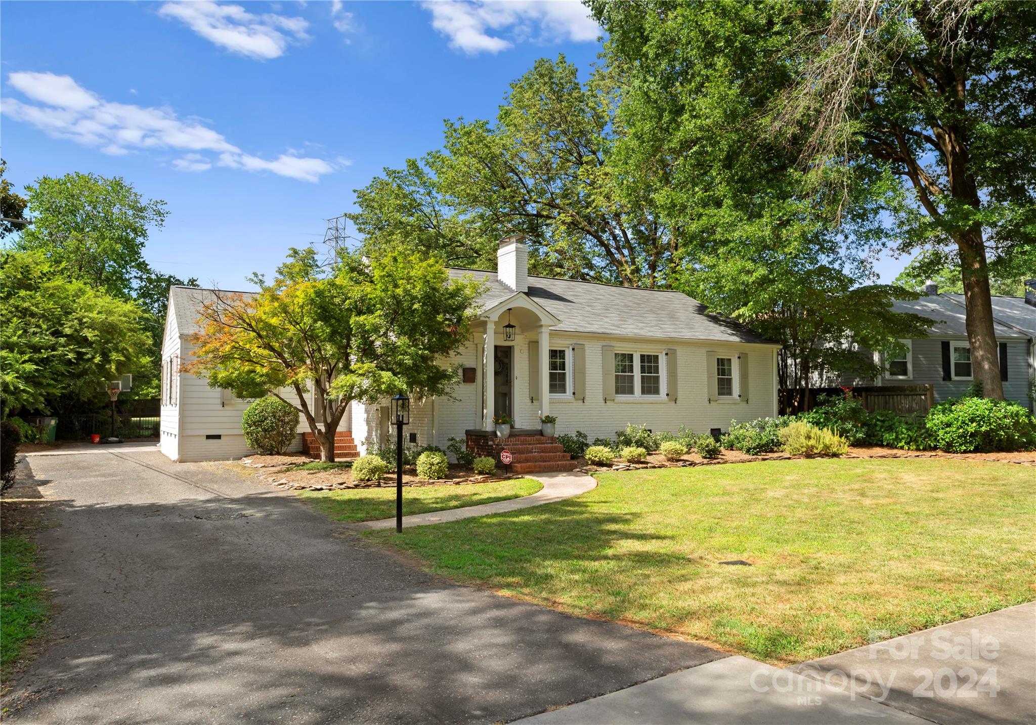 1108 Sedgefield Road Charlotte, NC 28209 - Photo 2 of 24 a front view of a house with a yard