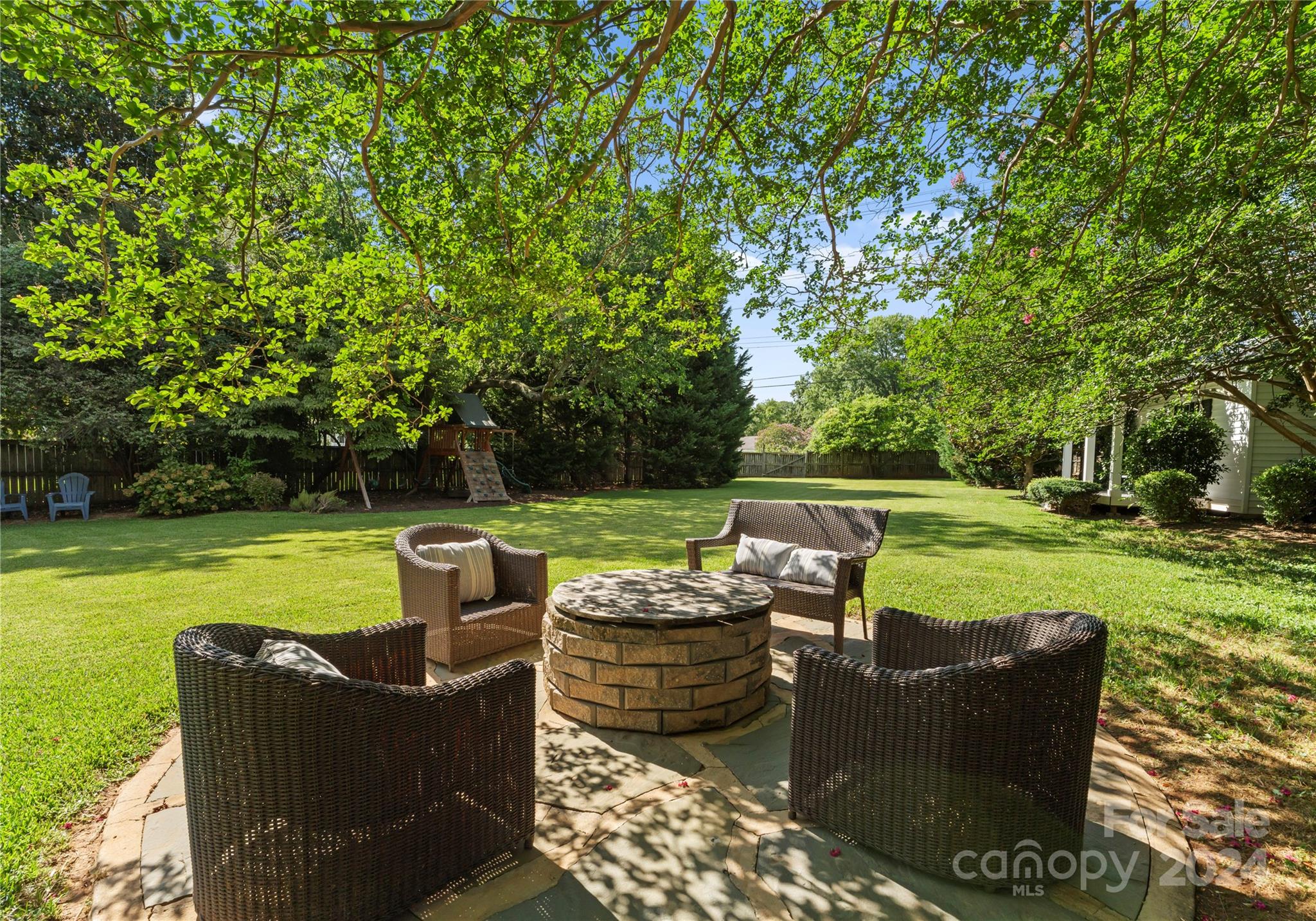 1108 Sedgefield Road Charlotte, NC 28209 - Photo 22 of 24 a view of a chair and table of the garden