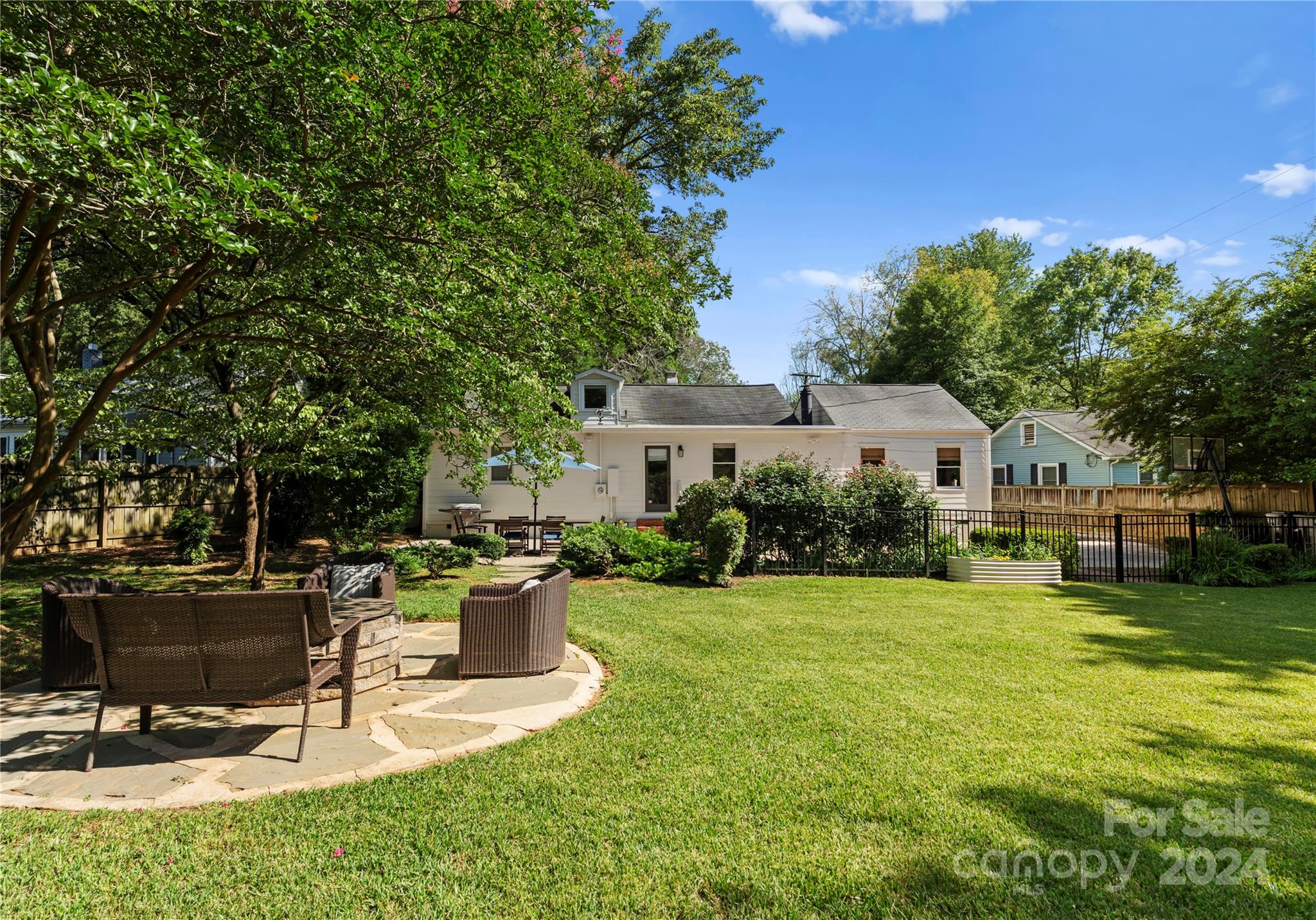 1108 Sedgefield Road Charlotte, NC 28209 - Photo 23 of 24 a view of a house with backyard porch and sitting area