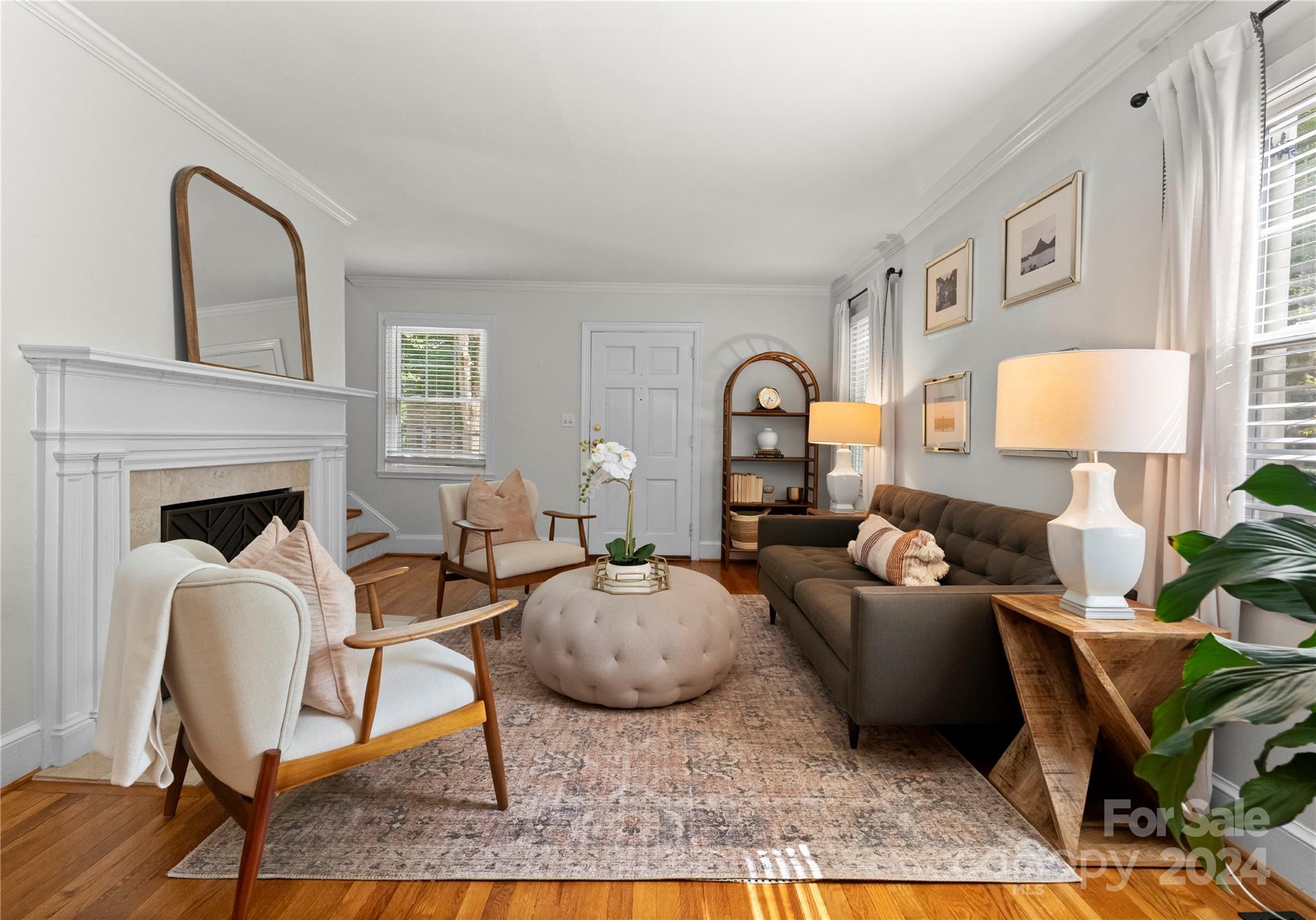 1108 Sedgefield Road Charlotte, NC 28209 - Photo 4 of 24 a living room with furniture a fireplace and a table