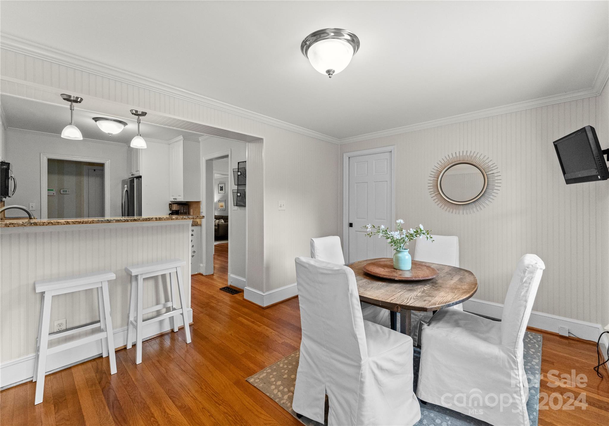 1108 Sedgefield Road Charlotte, NC 28209 - Photo 10 of 24 a view of a dining room with furniture and wooden floor